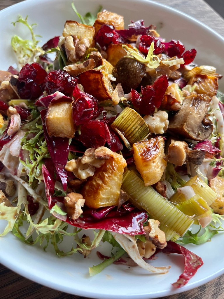 Beautiful frisse and radicchio salad .